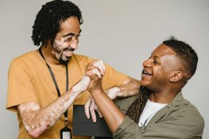 Two people celebrating sobriety and their accomplishments.
